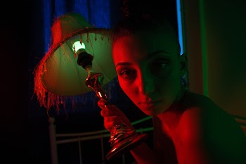 Woman Holding Black and Gray Table Lamp