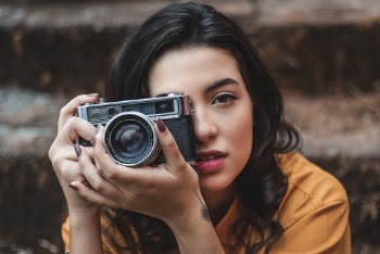 Woman Holding Black Camera