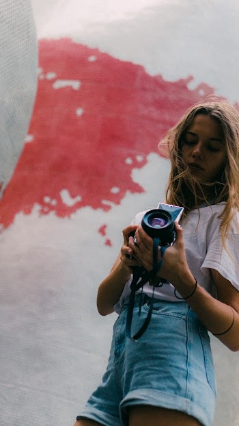 Woman Holding Black Camera