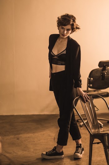 Woman Holding Black Chair