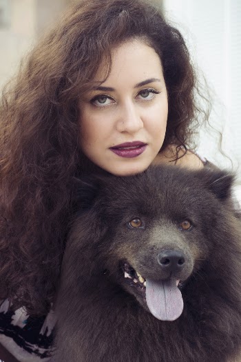 Woman Holding Black Dog