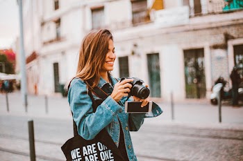 Woman Holding Black Dslr Camera