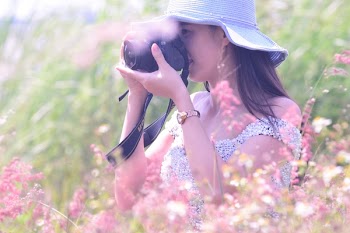 Woman Holding Black Dslr Camera