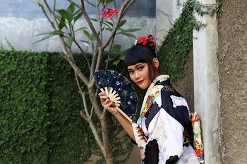 Woman Holding Black Fan