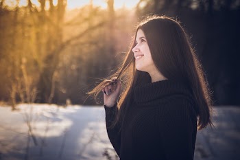 Woman Holding Black Hair