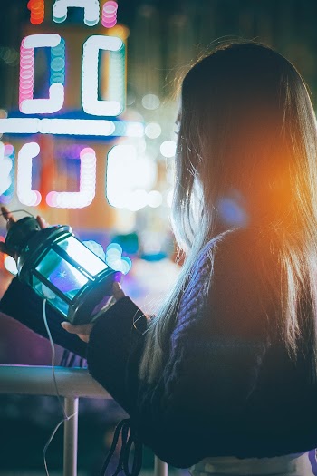 Woman Holding Black Lantern