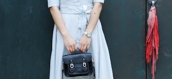 Woman Holding Black Leather Bag
