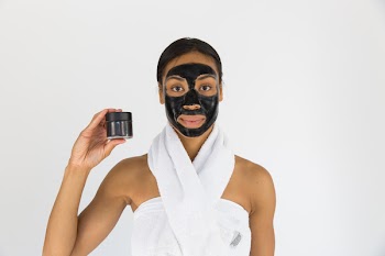 Woman Holding Black Mask
