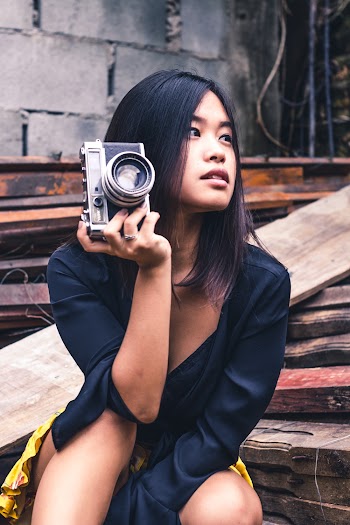 Woman Holding Black Slr Camera