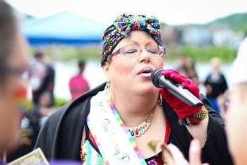 Woman Holding Black Wireless Mic