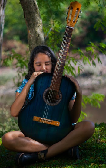 Woman Holding Blue Classical Guitar