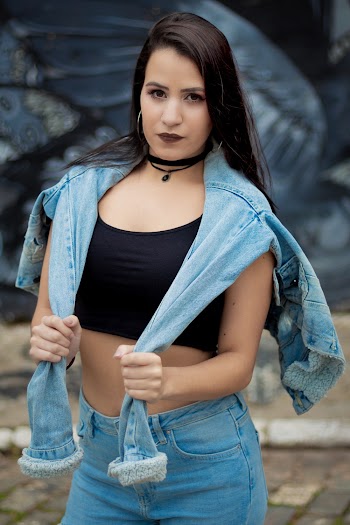 Woman Holding Blue Denim Jacket