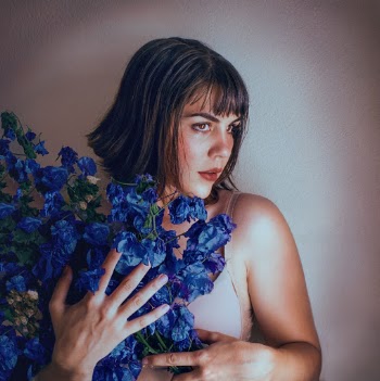 Woman Holding Blue Flower Bouquet