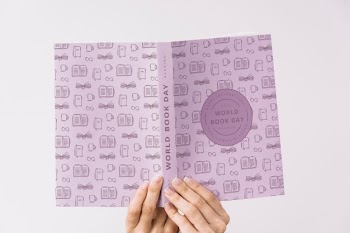 Woman holding book cover mockup Free Psd