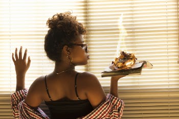 Woman Holding Book With Burning Paper