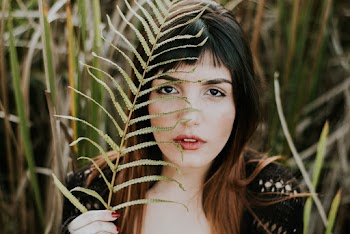 Woman Holding Boston Fern