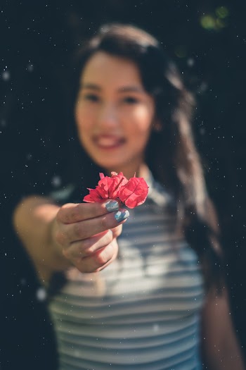 Woman Holding Bougainvillea Flower