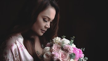 Woman Holding Bouquet of Flowers