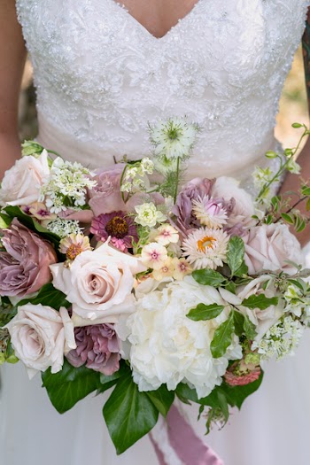 Woman Holding Bouquet of Flowers