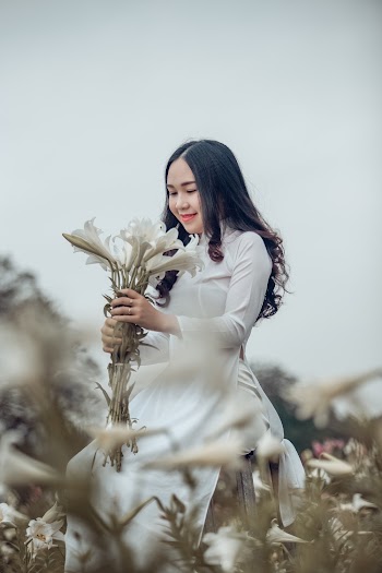 Woman Holding Bouquet of Flowers