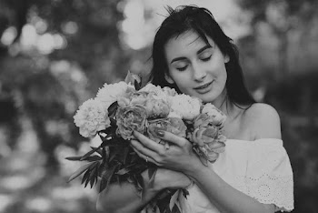 Woman Holding Bouquet Of Flowers