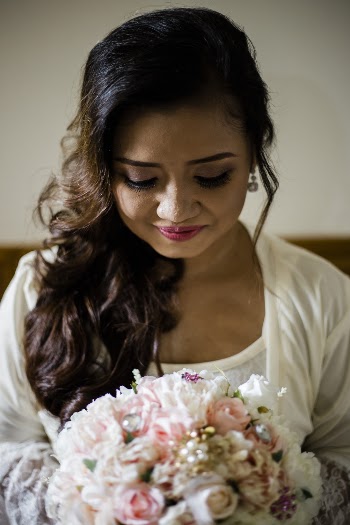 Woman Holding Bouquet of Flowers