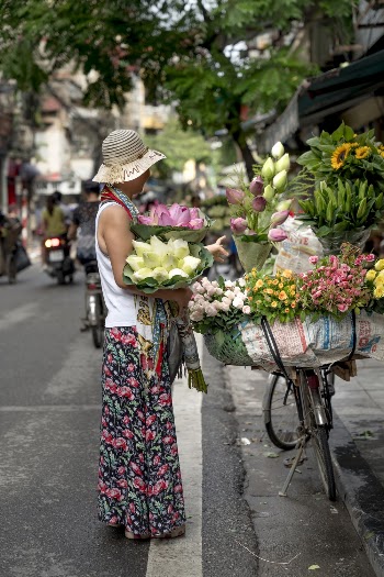 Woman Holding Bouquet of Flowers