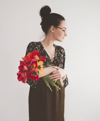 Woman Holding Bouquet of Flowers