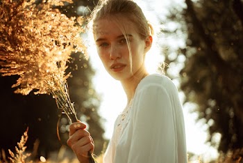 Woman Holding Bouquet of Flowers