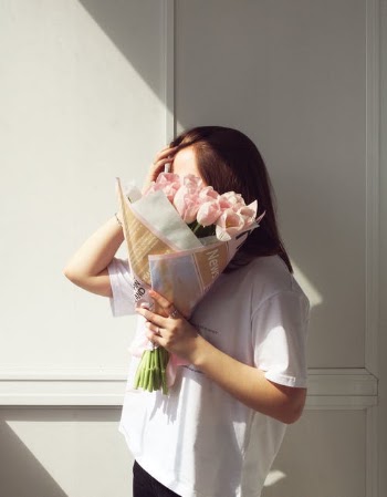 Woman Holding Bouquet of Flowers · Free Stock Photo