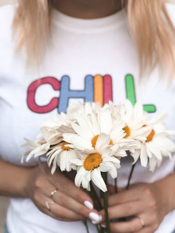 Woman Holding Bouquet of White-and-yellow Common Daisy Flowers