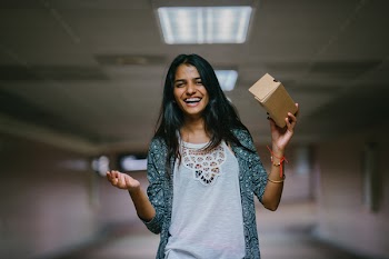 Woman Holding Brown Cardboard Box