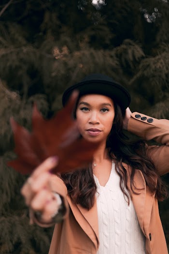 Woman Holding Brown Maple Leaf