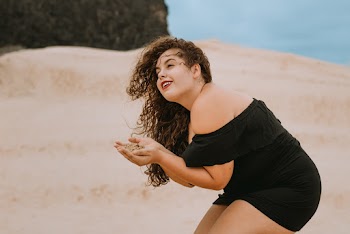 Woman Holding Brown Sand
