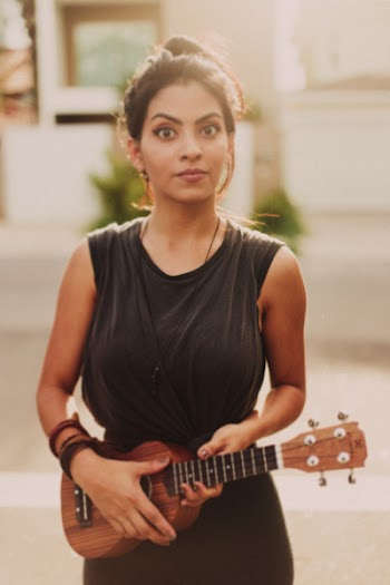 Woman Holding Brown Ukulele String Instrument