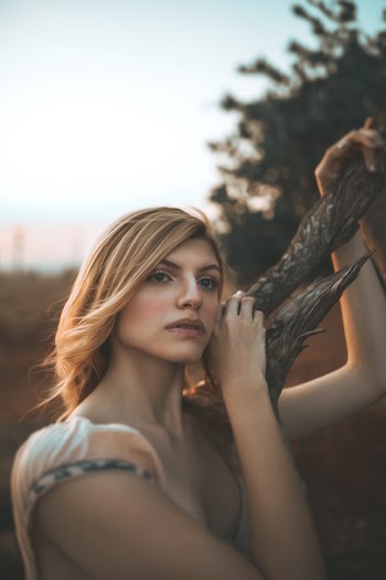 Woman Holding Brown Wood