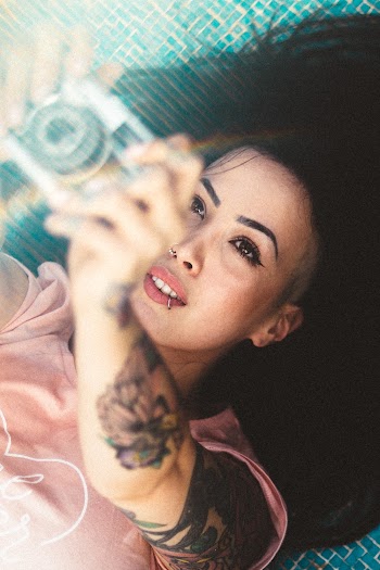 Woman Holding Camera
