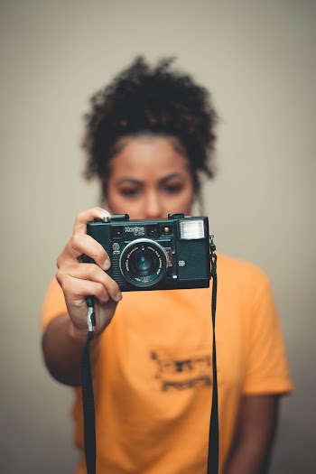 Woman Holding Camera