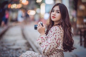 Woman Holding Camera