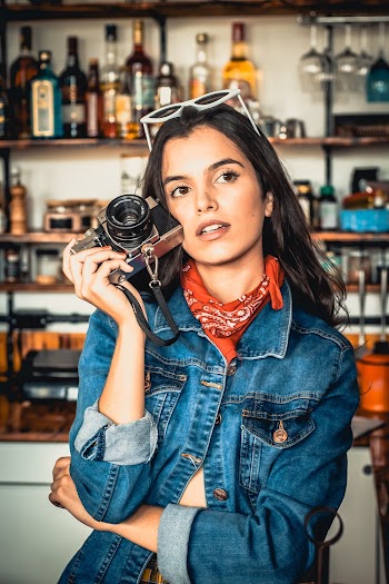 Woman Holding Camera