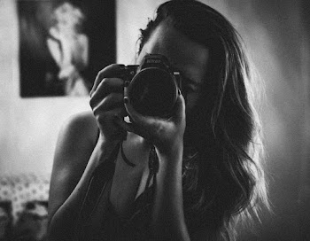 Woman Holding Camera