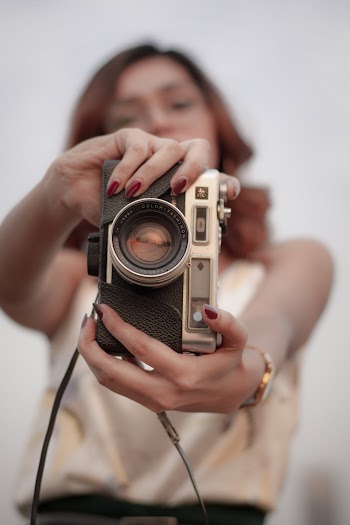 Woman Holding Camera