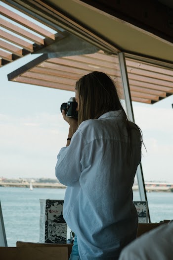 Woman Holding Camera