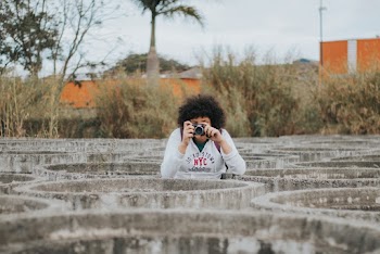 Woman Holding Camera