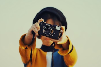 Woman Holding Camera