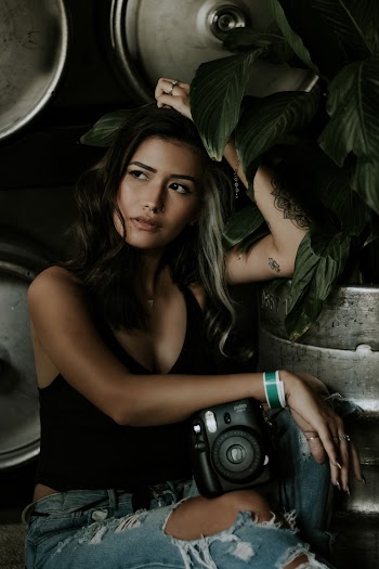 Woman Holding Camera