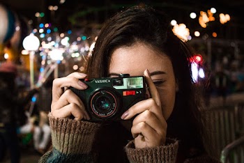 Woman Holding Camera