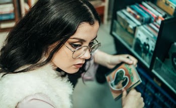 woman holding CD case