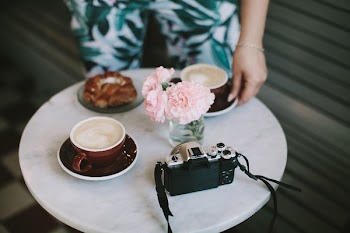 Woman Holding Ceramic Saucer