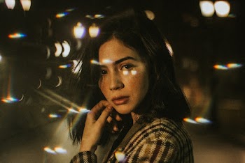 Woman Holding Cheek With Light Effect Photo